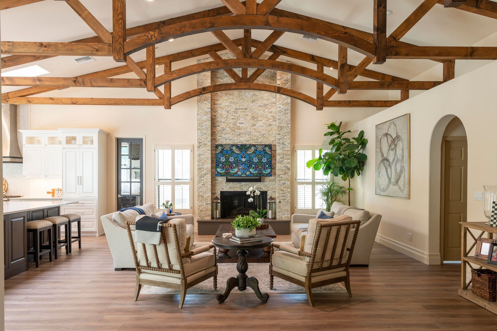 Bright and stylish living room featuring rustic wooden beams and modern design elements.
